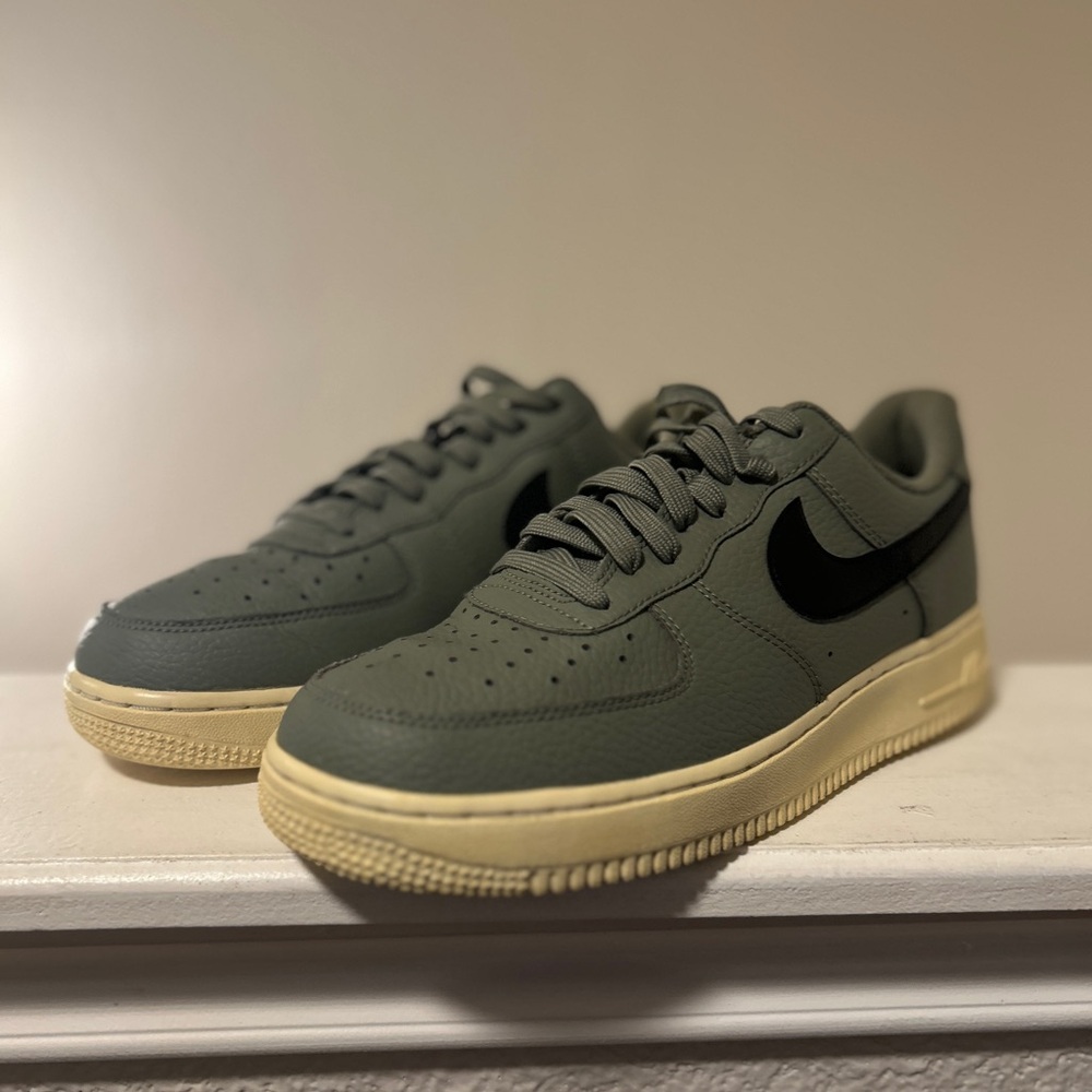 This is a new Nike Air Force 1 Low '07 sneaker in Dark Stucco/Summit White-Black